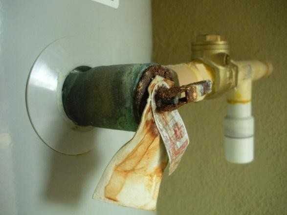 A corroded and unsafe pressure relief valve hot a hot water tank